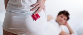 Girl holding a condom