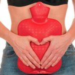 Girl and red hot water bottle