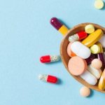 Medications in a wooden spoon