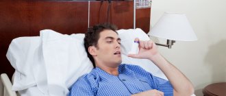 Man in bed with inhaler