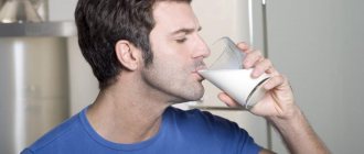 Man takes pills with milk